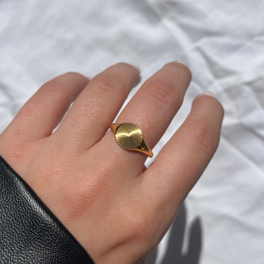 The gold sunburst signet